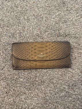 Coach Metallic snake-embossed leather envelope wallet in a muted gold tone
